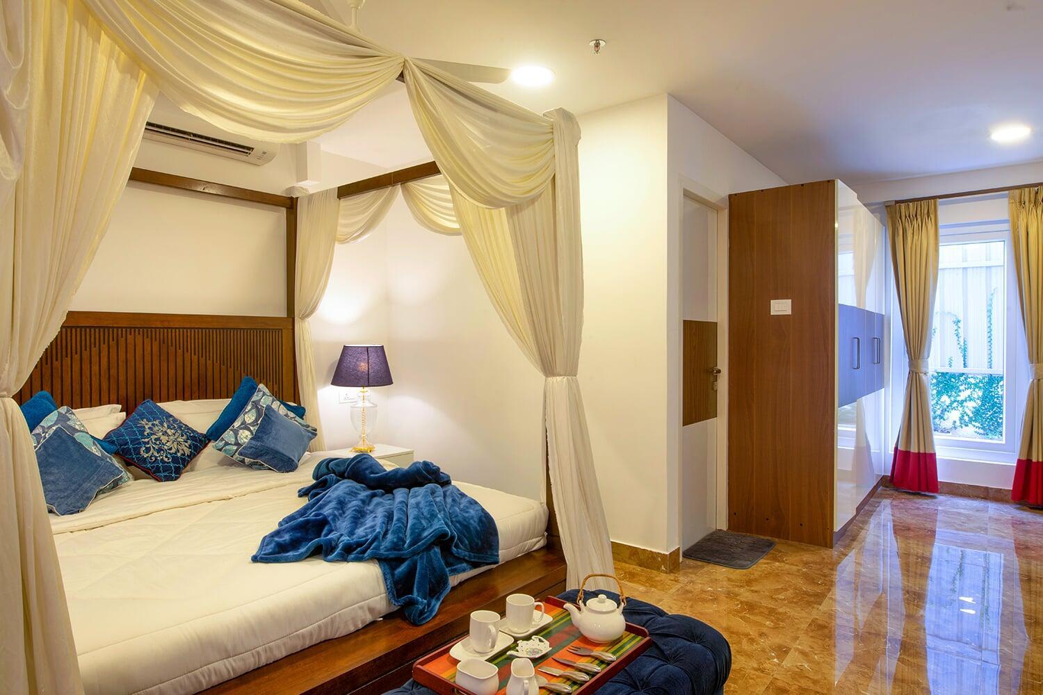 Cozy bedroom at Risa Banquets – event accommodation Chennai